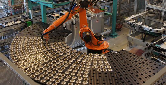 Assembly of components by robot Automation assembly line for the machinery industry
